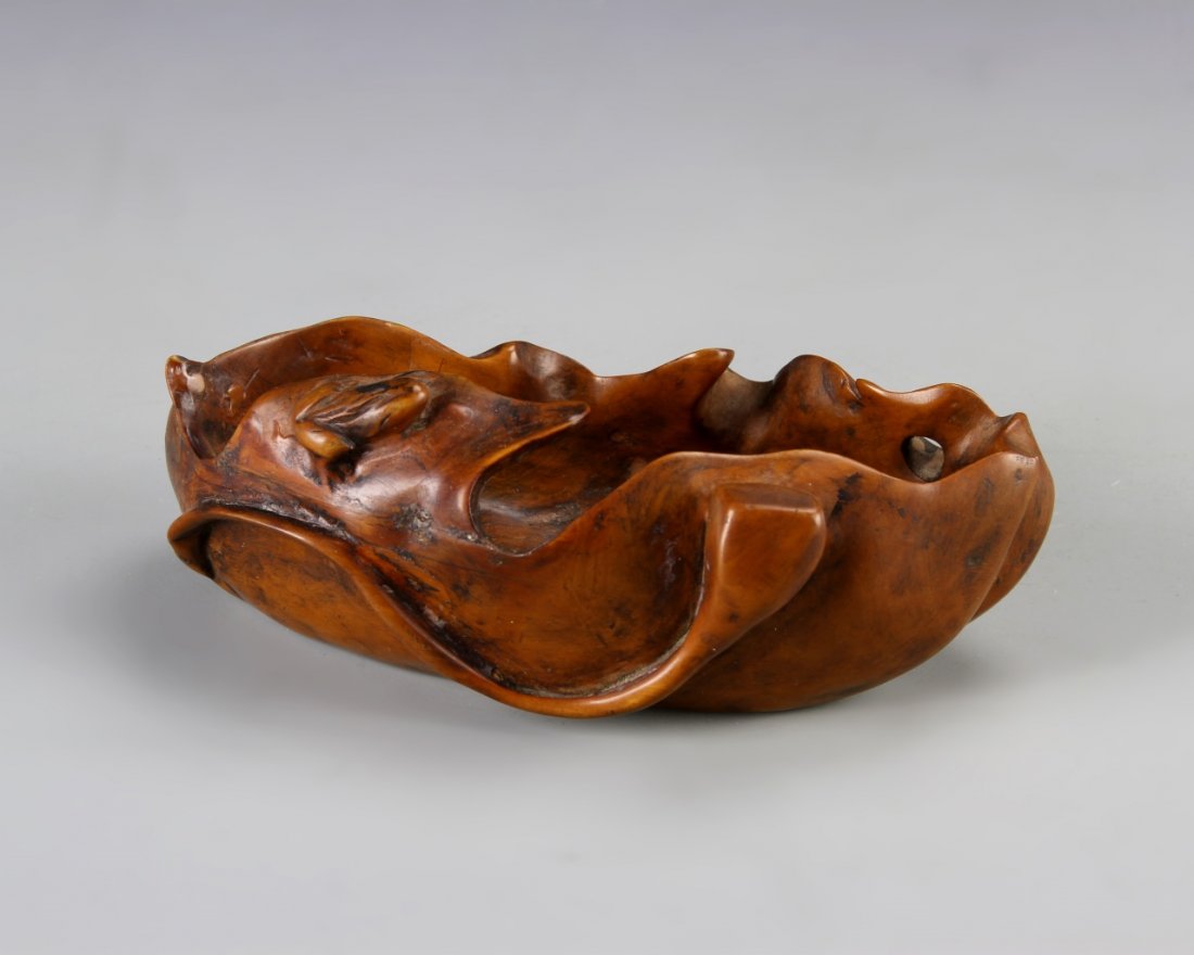 Chinese Boxwood Brush Washer: China, 19th C., boxwood brush washer, in the shape of a leaf, with a rippling rim line, and a small carved frog resting on the side. Length 5 1/4 in., Width 3 in., Height 2 in.