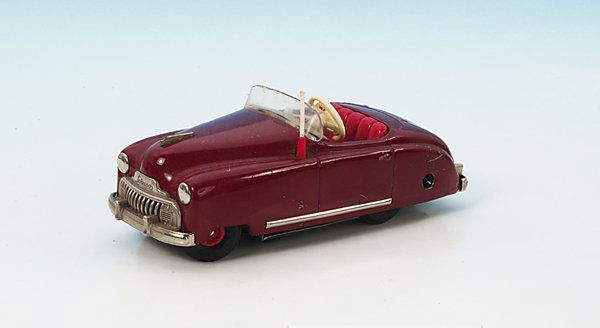 SCHUCO Radio 4012 Auto: Blech, seltene Farbe Marron, mit funktionierender Spieluhr. Gebrauchsspuren, mit Uhrwerkschlüssel.