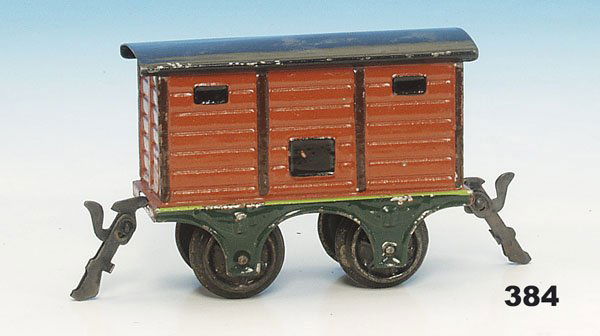 1 MARKLIN uralt Packwagen 1803/0: 2 achs., 10 cm, braun, Dach schwarz, Hakenkupplungen, guter Orig.-Zustand, leichte altersgerechte Gebrauchsspuren.