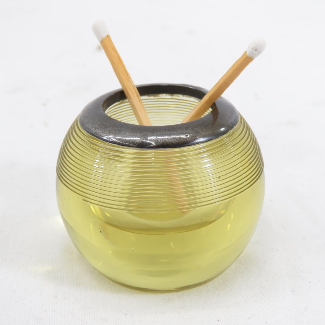 1899 Sterling Collar Yellow Glass Match Striker: Collar is stamped with Birmingham anchor, British sterling lion passant, and "z" (1899) date mark, as well as maker's hallmark, 1.5"h x 2", wear consistent with age All antique items have wear consist