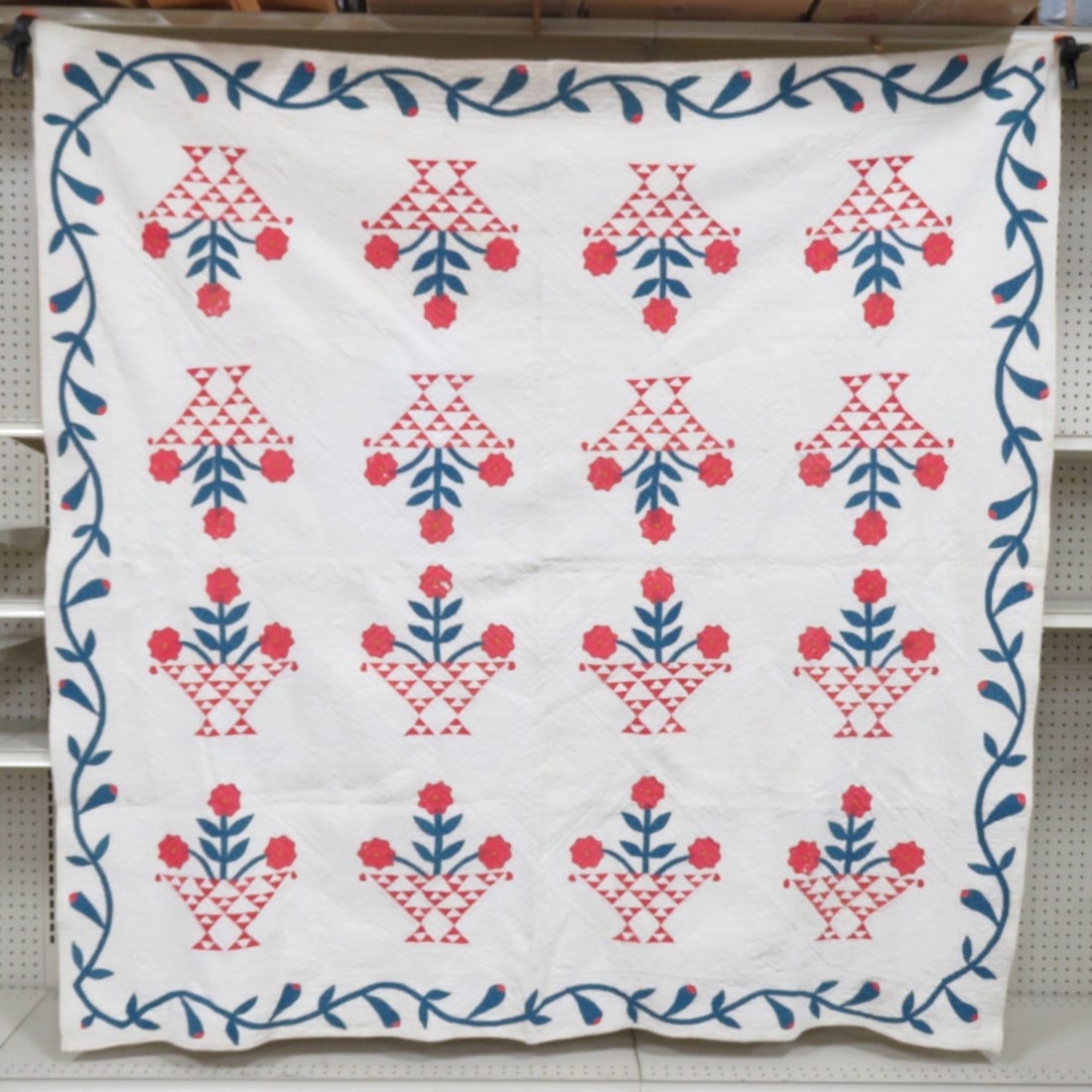 Antique Folk Art Flowers in Basket Quilt 73 x 72": hand stitched applique, some staining, super high detail,white with red flowers, minor wear on flowers, staining on back All antique items have wear consistent with age please review all photos, and p