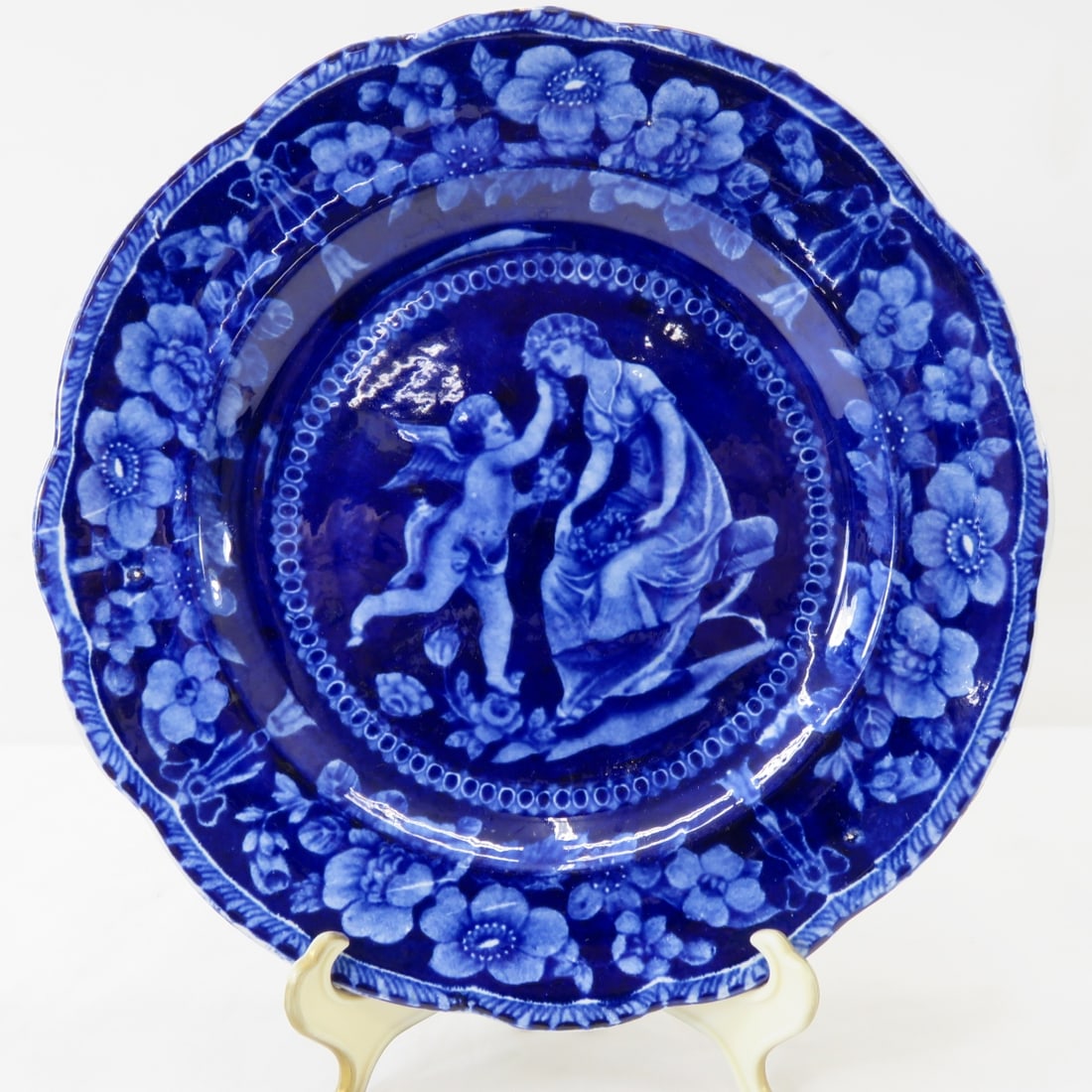 1820's "Cupid and Venus Holding a Garland" Plate: 9" deep flow blue transferware plate, William Adams III 1804?1829, Stoke-on-Trent, Staffordshire, marked: "Adams (bird) Warranted Staffordshire" All antique items have wear consistent with age please