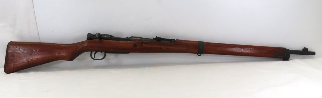 Japanese Arisaka Type 99 7.7mm Rifle: 26" barrel with front blade & rear adjustable ladder sight, straight bolt, ground mum on receiver- , SN#13086 , Toyo Kogyo arsenal marks 1939-1945 , series mark 34, wood stock, fair condition with wea