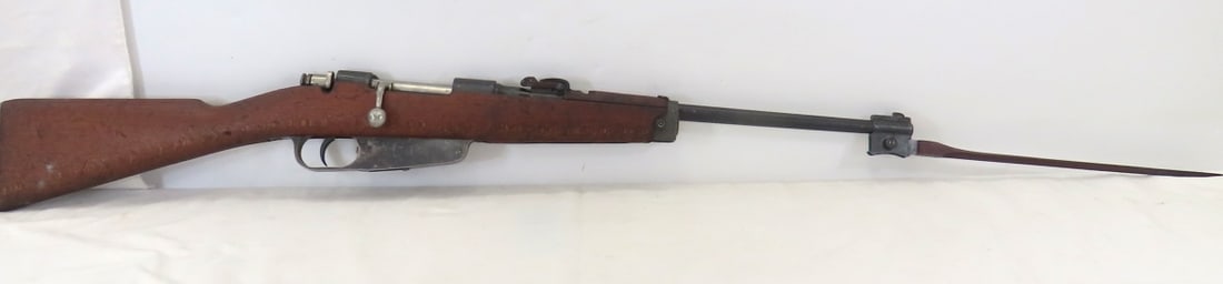 Italian M38 Carcano Carbine 6.5x52mm Rifle: 17.7" barrel with front blade and adjustable rear sight, OAL 36", curved bolt, folding bayonet (slight wiggle), receiver marked "FNA B (Brescia)" and SN#YH3001, wood stock marked 8986, good condition