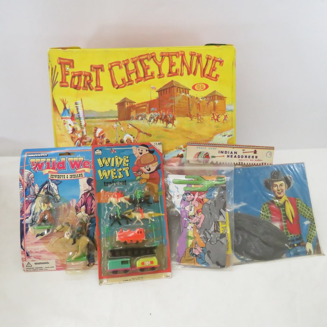 Vintage Ideal Fort Cheyenne Set & Western Toys: Fort Cheyenne with soldiers & Indians as shown, NIP Cowboy Game, Indian Headdress, Gyser Wide West Train set (unpunched), Britain's Wild West Cowboys & Indians Please read terms & conditions and ask q