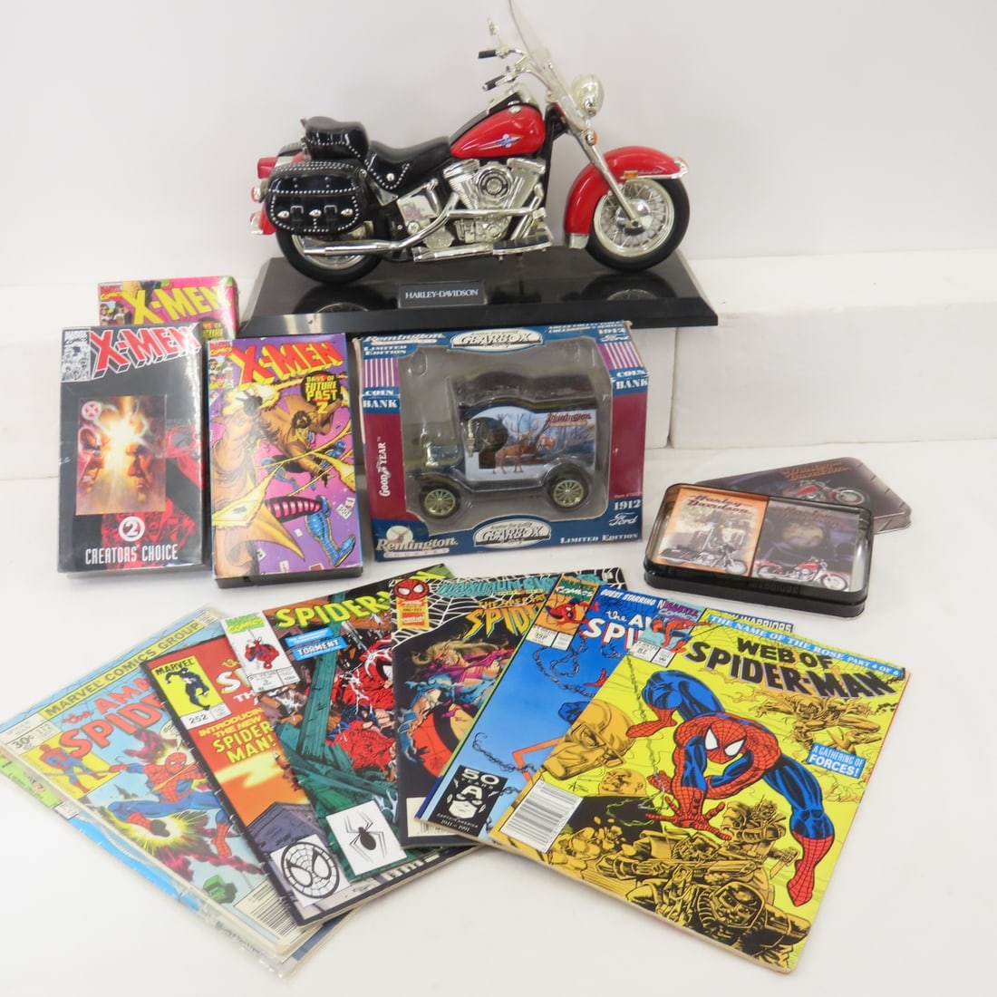 Comics, Gearbox Remington Bank & Harley Items: Harley cards & phone- no cord, X-Men videos, Spider-Man Comics Please ask questions and read terms & conditions before bidding.
