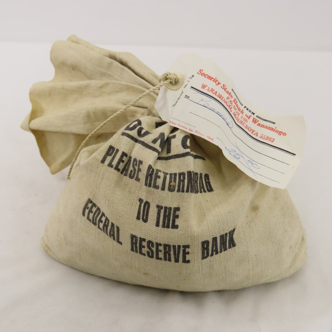 $25 in pennies in old sealed bank bag: Please ask questions and read terms & conditions before bidding