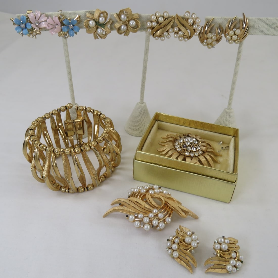 Vintage Trifari Gold Tone Jewelry Wear & Repair: Vintage Trifari Gold Tone Jewelry Wear & Repair1) crown Trifari gold tone wide picket fence bracelet, 2) pair crown Trifari enameled & rhinestone floral clip earrings, 3) 3 pair crown Trifari matte go