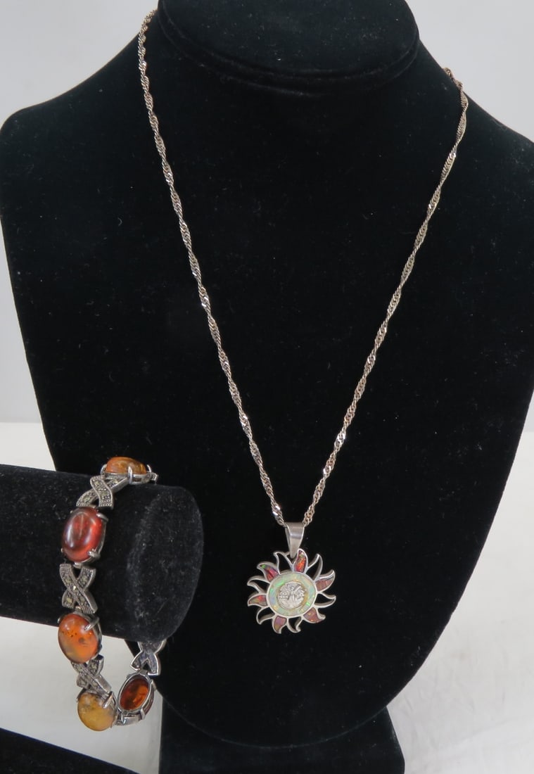 Sterling Necklace and Sterling & Amber Bracelet: Sterling Necklace and Sterling & Amber Bracelet1) 925 marked marcasite and amber bracelet 7" 17+ grams, 2) 19" twist necklace marked 925 Italy (has slight magnetic pull) with with inlaid sun pendant- 