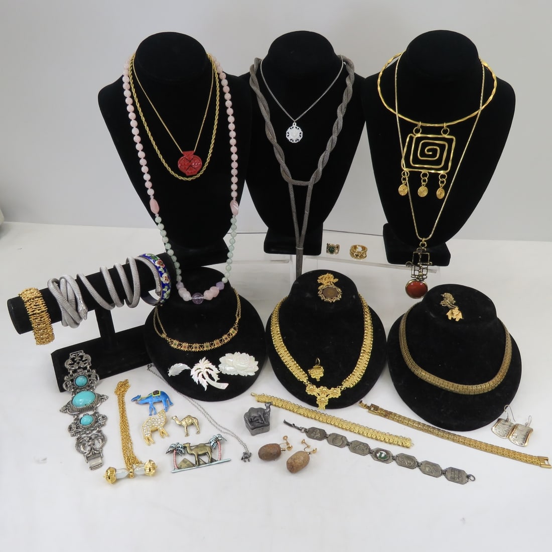 Egyptian Revival and Other Vintage Jewelry: Egyptian Revival and Other Vintage JewelryCamel brooches, brass choker, mother of pearl brooches, bracelets, D'Orlan bracelet , Laxaro brass and sterling earrings, and more Please ask questions and re