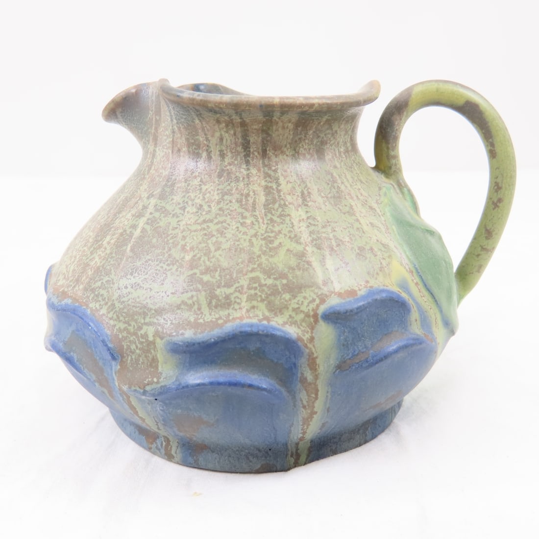 Ephraim Pottery Waterlily Pitcher- Ken Nekola: Ephraim Pottery Waterlily Pitcher- Ken NekolaApproximately 3.5"H x 4.5"W Year Retired: 2010, limited edition of 103 Please ask questions and read terms & conditions before bidding.
