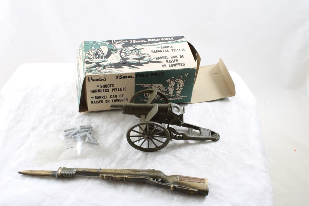 Premier Toy Field Canon, Bayonet Letter Opener: Premier Toy Field Canon, Bayonet Letter Opener Old Niagra Brass Bayonet letter opener 8" long and Premier's 75mm Field Piece Canon in box. Shoots harmless pellets both as pictured. Please read ask que