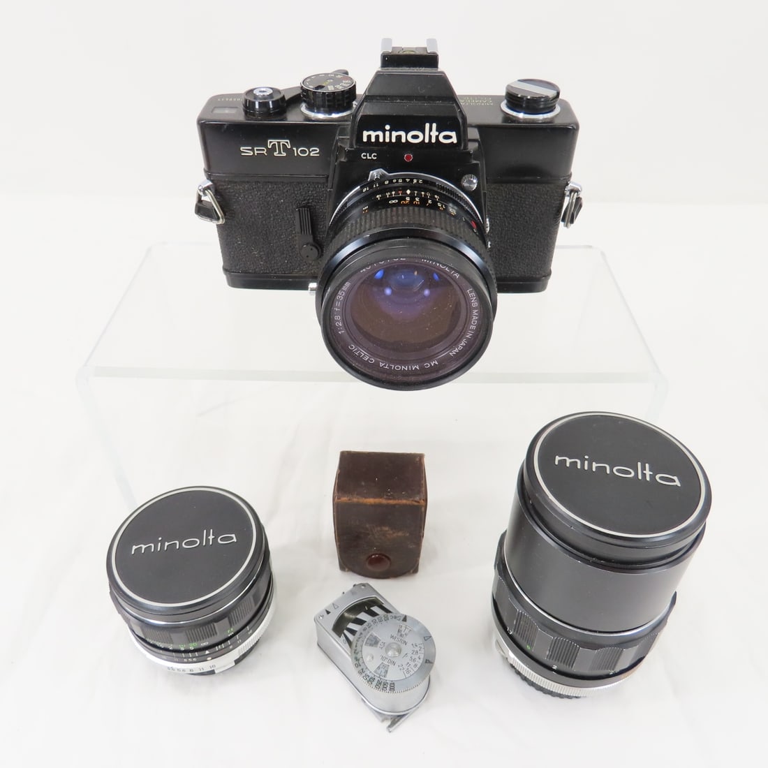 Minolta SRT 102 35mm Film Camera with lenses: Minolta SRT 102 35mm Film Camera with lenses 35mm f/2.8, 28mm f/3.5 & 135mm f/2.8 Please read terms & conditions and ask questions before bidding.