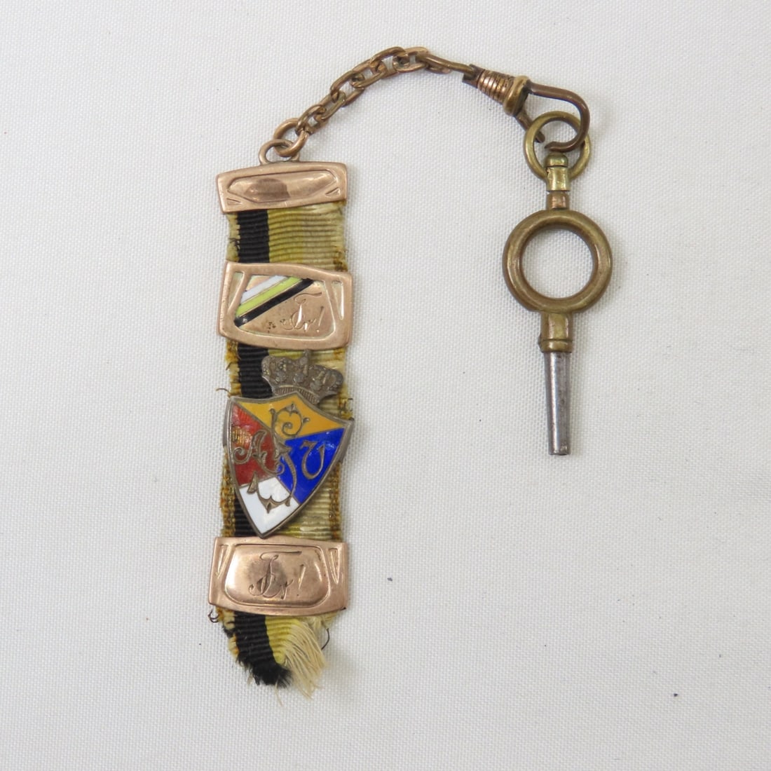 German 1914-16 10K & 800 Bierzipfel with Insignia: German 1914-16 10K & 800 Bierzipfel with Insigniatop band is marked "333" on back, 2nd piece down has white/ yellow/ black stripe to match ribbon with engraving on front and back, 3rd piece down is a