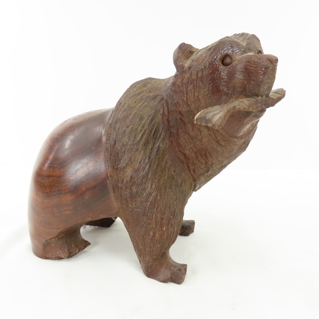 Hand Carved Ironwood Grizzly Bear With Fish: Hand Carved Ironwood Grizzly Bear With Fishapprox 8x8x5", fish tail has section missing finish Please ask questions & read terms & conditions before bidding.