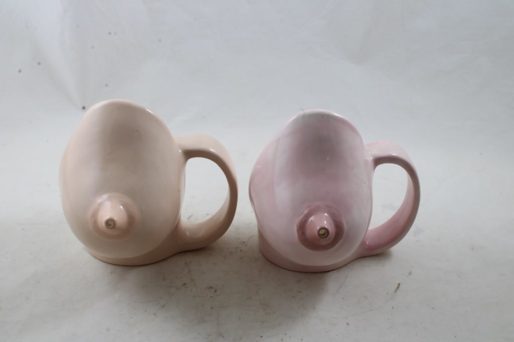 2 Ceramic Breast Figural Mugs: 2 Ceramic Breast Figural MugsSome small chips as pictured. Please ask questins and read terms & conditions before bidding.