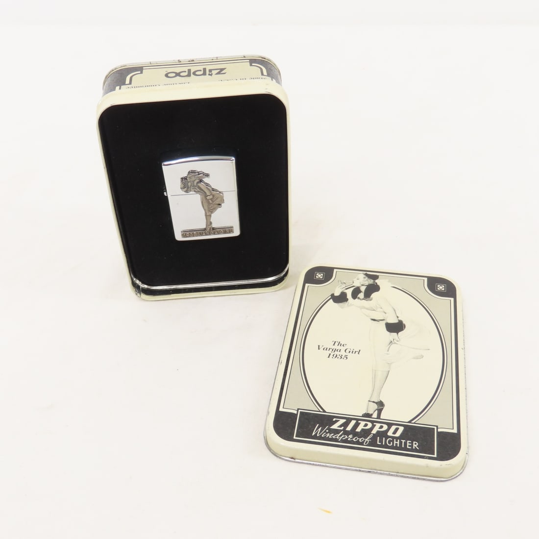 The Varga Girl 1935 Zippo lighter in tin new: The Varga Girl 1935 Zippo lighter in tin new Please ask questions and read terms & conditions before bidding.