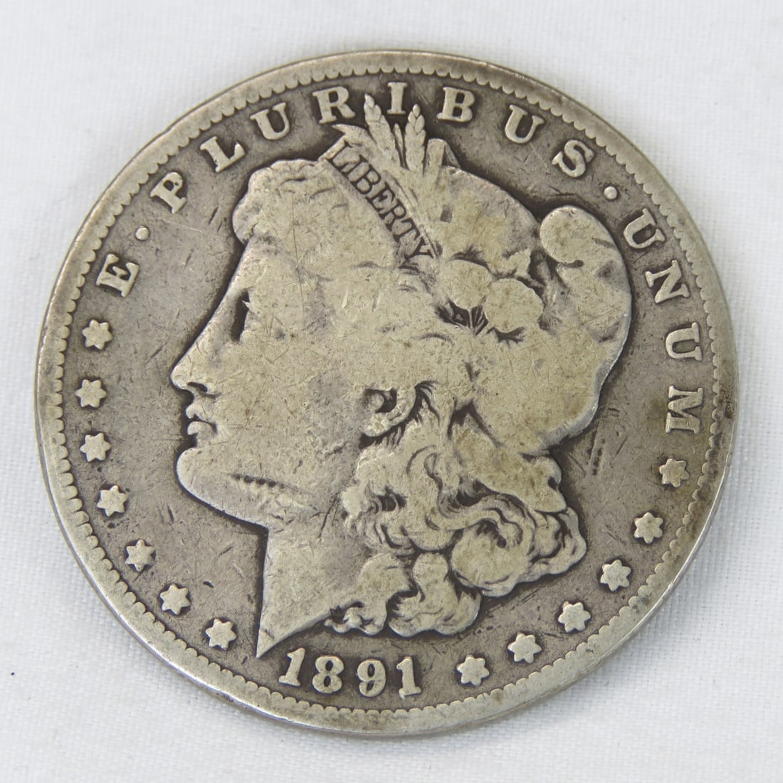 1891 CC Morgan Silver Dollar: Please ask questions and read terms & conditions before bidding.