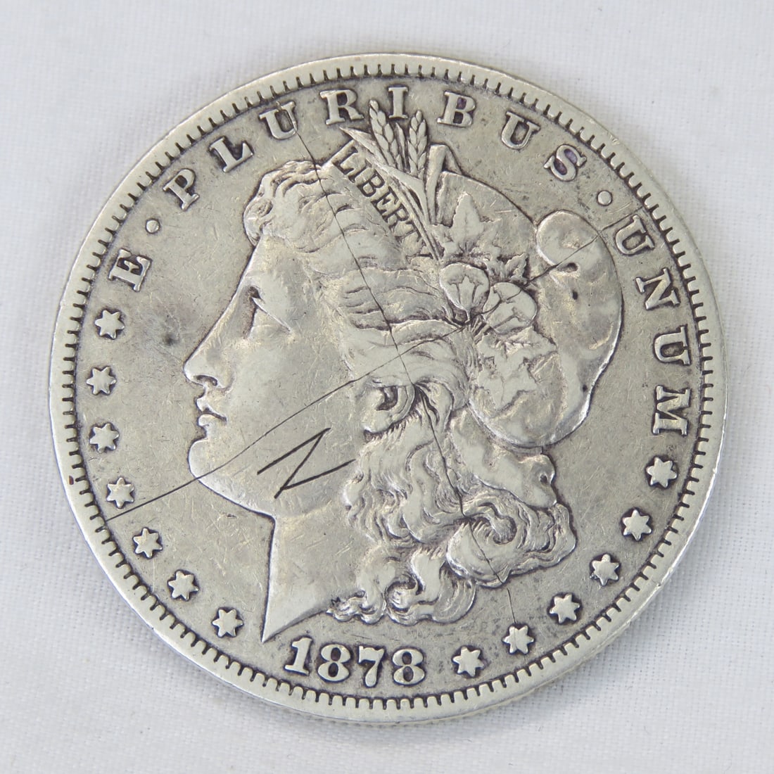 1878 CC Morgan Silver Dollar: scratches on both sides Please ask questions and read terms & conditions before bidding.