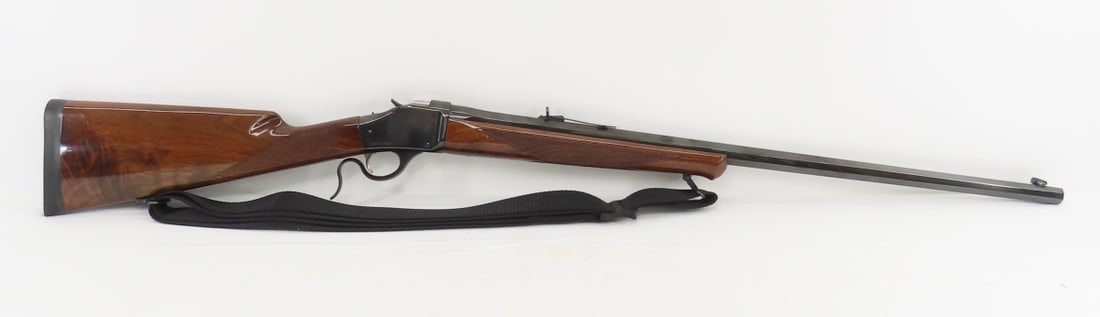 Browning 1885 .45x70 GV'T High Wall Rifle: falling block action, 28" octagon barrel, front blade and rear sight, barrel marked "BROWNING MODEL 1885 CALIBER .45-70 GOV'T", and "BROWNING ARMS COMPANY MORGAN UTAH & MONTEAL P.Q. / MADE IN JAPAN". 