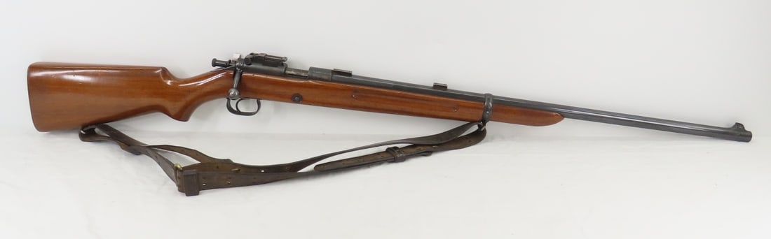 Winchester Model 52 .22 LONG R Bolt Action Rifle: 28" barrel with front blade sight and scope mounts, rear field sight marked "PAT NOV 11.1919 AR 27.1920",1 5 round magazine, wood pistol grip stock, adjustable leather sling, SN# 17456, manufactured 1