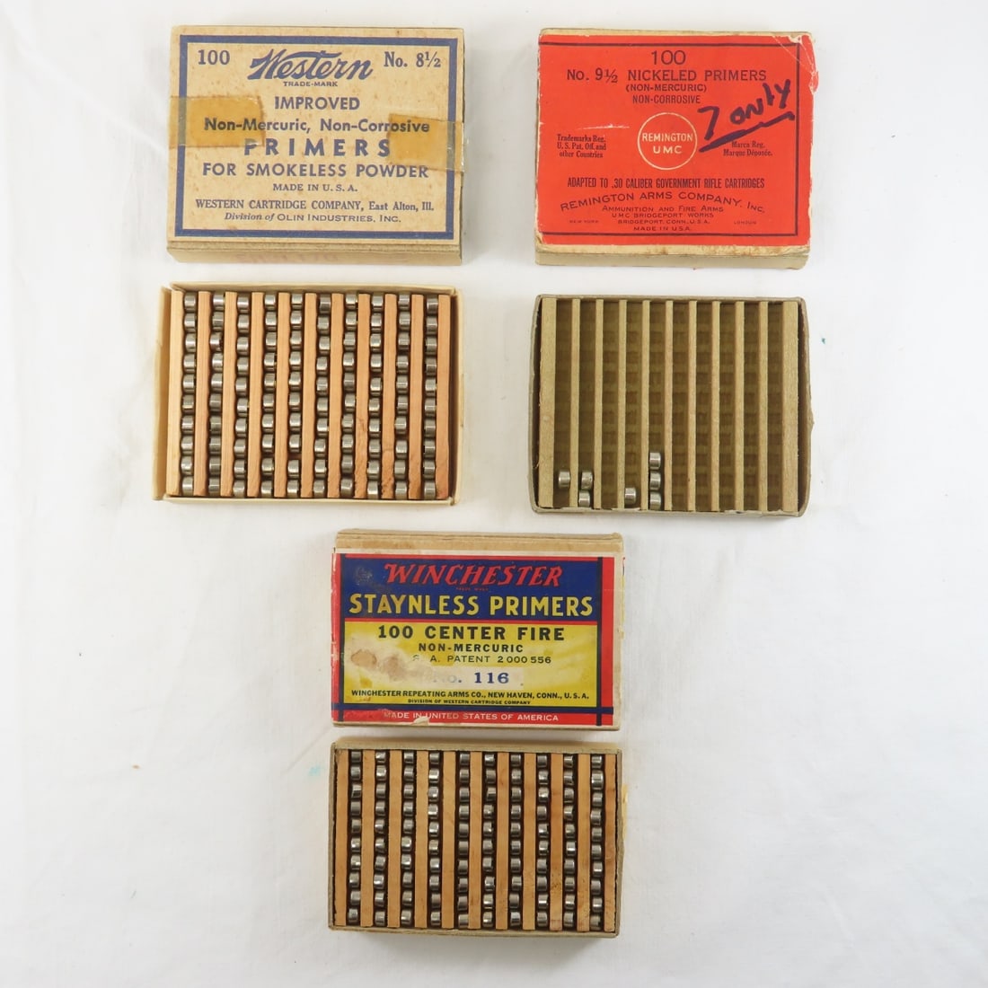 207 Vintage Hand Gun Primers in Boxes: 100 Winchester No. 116 CF STAYNLESS in original box- some damage to label, 100 Western No 8 1/2 for smokeless powder in original box (tape), and 7 Remington No 9 1/2 nickeled primers for .30 cal gvt r