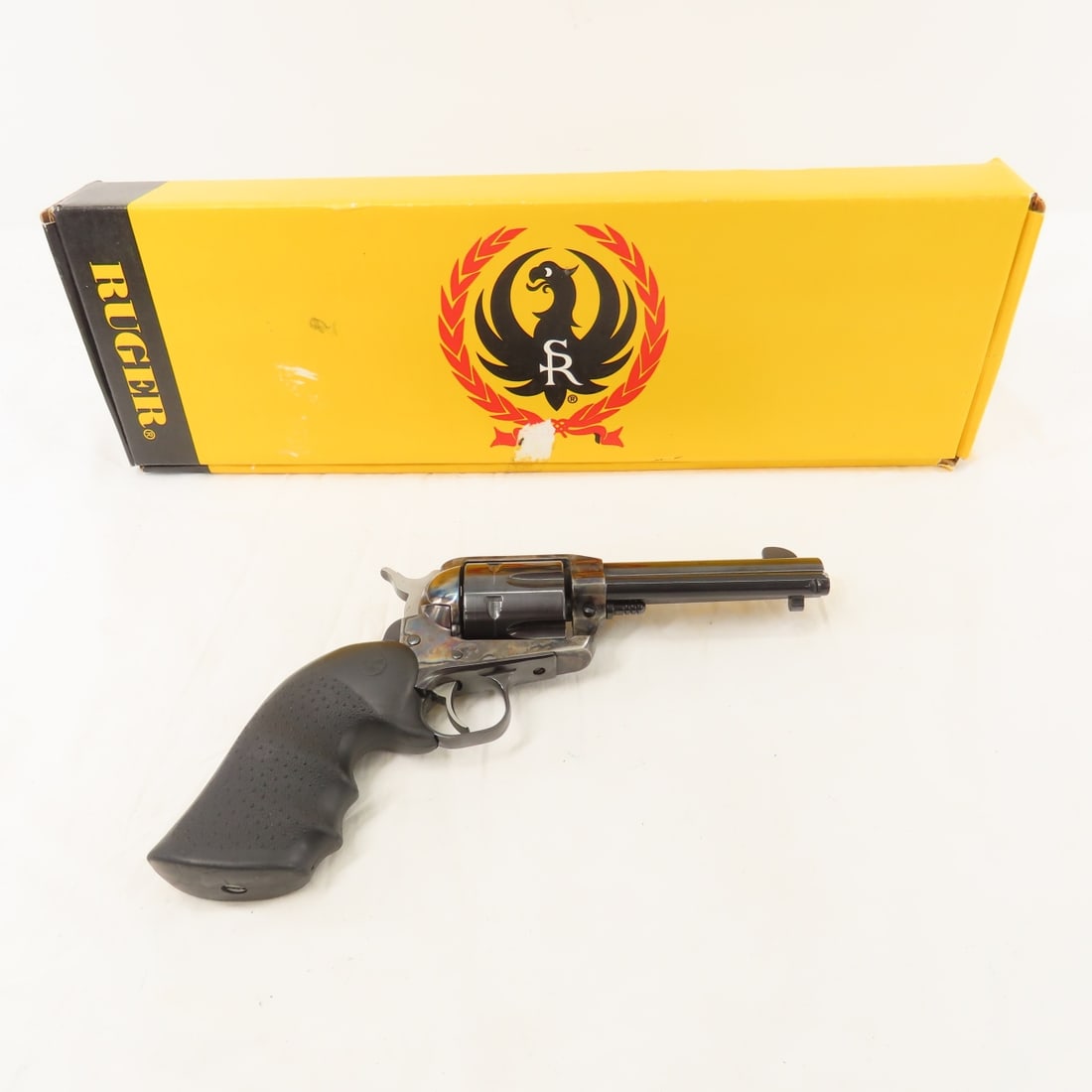 Ruger Vaquero .45 Cal Revolver with Box: 4 5/8" barrel, 6 shot, rubber grips, serial # 55-89396. Manufactured 1993-2005. Overall very good condition. FFL transfer required, please know local laws before bidding Please ask questions and read 