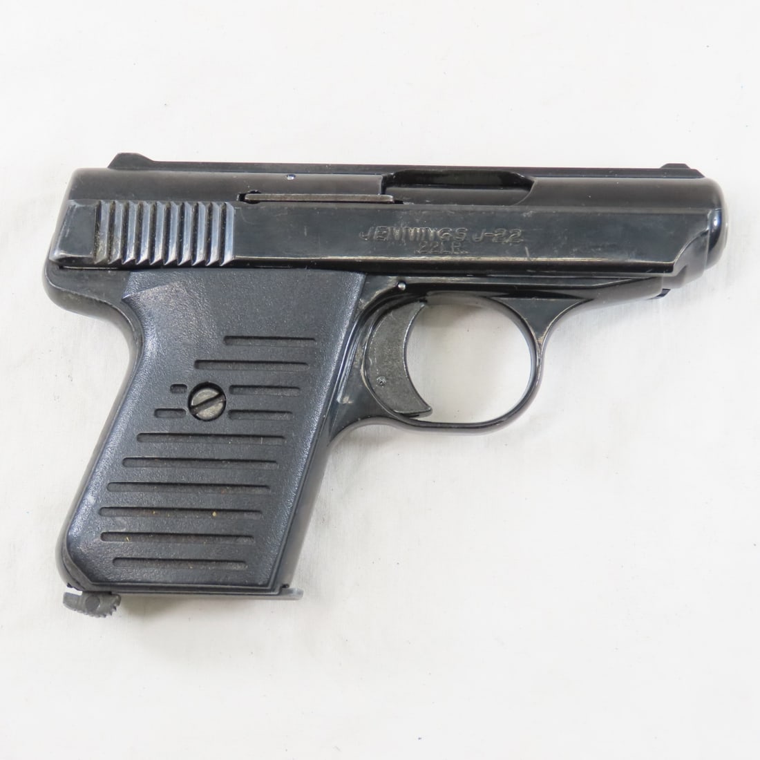 Bryco Arms Jennings J-22 .22LR Pistol: 2.5" barrel, black with combat grips, 1 6 round magazine, serial # 138978, Mfg. 1978-85. Overall fair condition- some discoloration. FFL transfer required, please know local laws before bidding Please