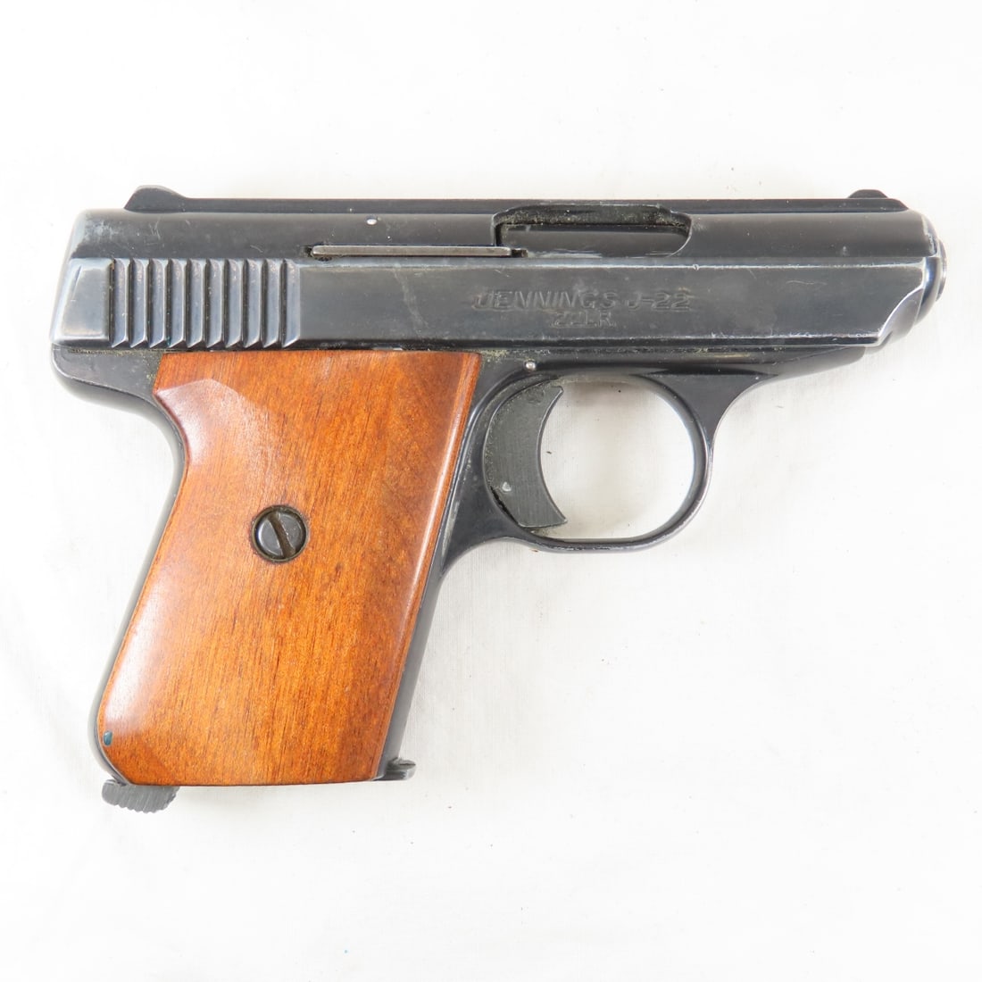 Bryco Arms Jennings J-22 .22LR pistol: 2.5" barrel, black with wood grips, 1 6 round magazine, serial # 145845 Mfg. 1978-85. Overall good condition. FFL transfer required, please know local laws before bidding Please ask questions and read