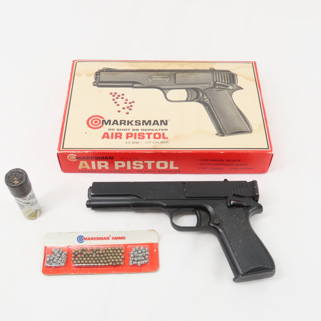Vintage Marksman .177 cal Air Pistol in Box: 20 shot repeater, BB's or pellets, with BB's in original box, action is not smooth- needs cleaning, water damage on box Please ask questions and read terms & conditions before bidding.