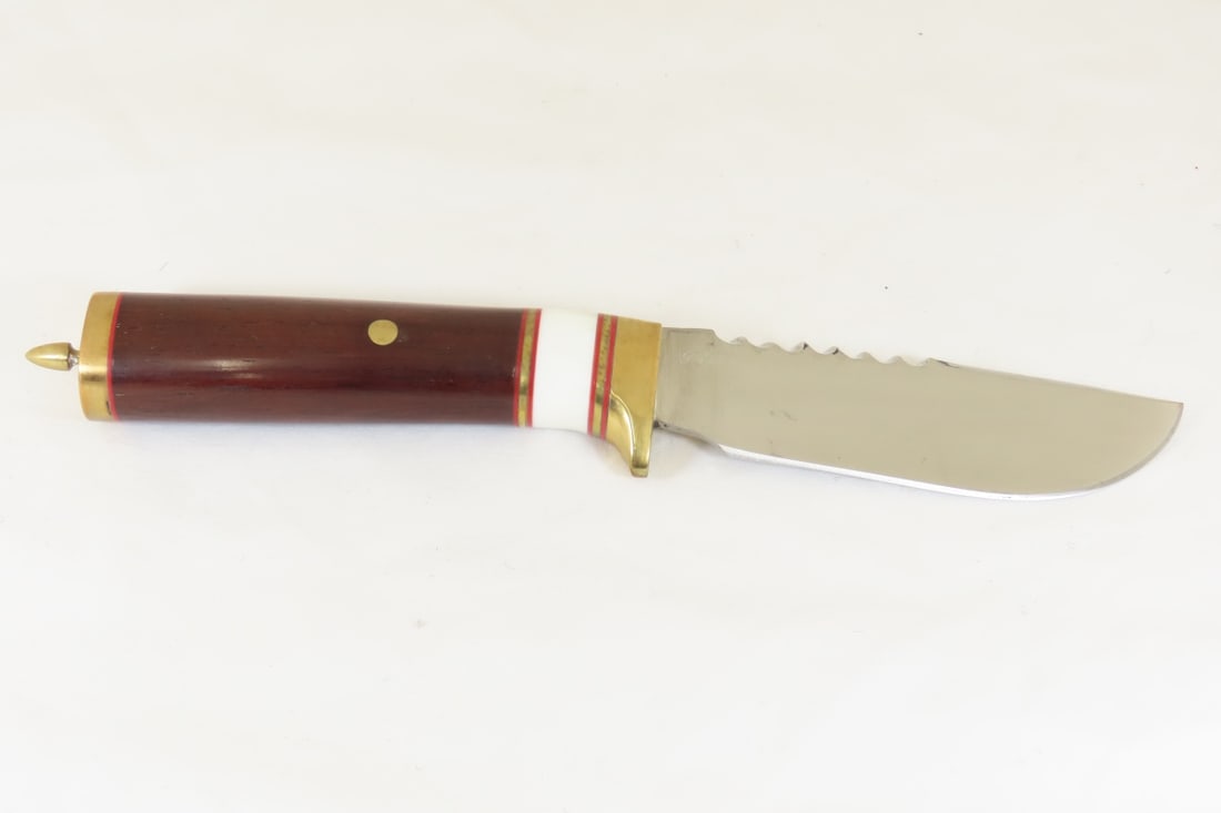 Hand Made Custom Knife by Dr. Robert E Molenaar: Hand Made Custom Knife by Dr. Robert E Molenaar Steel blade with file work, brass guard & butt, dark wood handle with fiber & brass spacers. Blade measures 4.5 inches, 10 inches overall. Signed R.E.M.