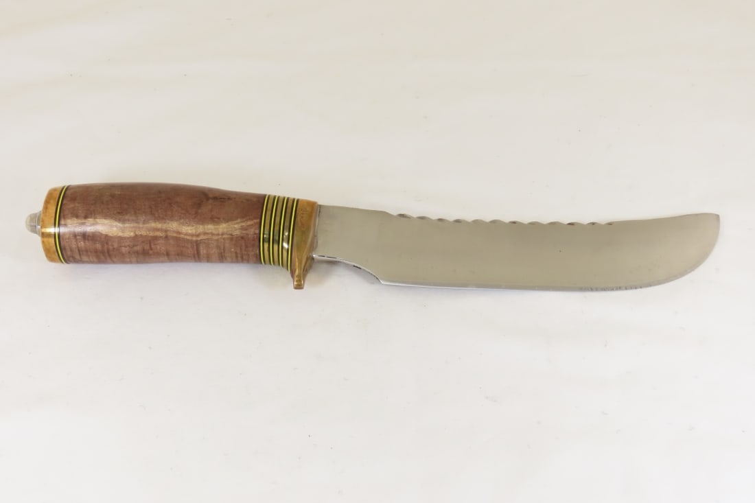 Hand Made Custom Knife by Dr. Robert E Molenaar: Hand Made Custom Knife by Dr. Robert E Molenaar Steel knife blade with file work, forged Patina spine, brass guard & butt, fiber & brass spacers. Wood handle, blade measures 7 inches, 12 inches overal