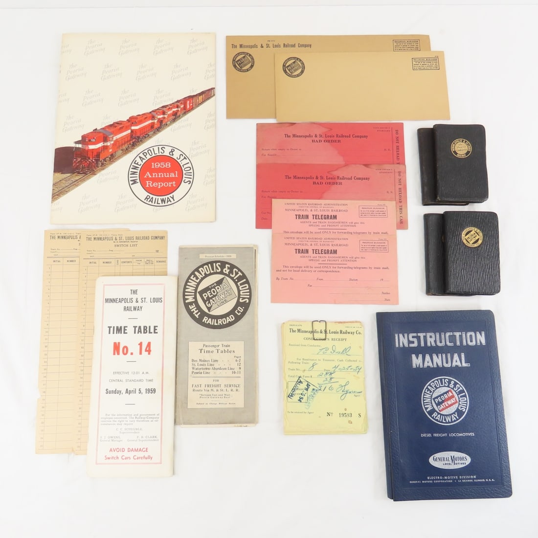 M&STL Ephemera, 1958 Annual report & More: 1950' pocket calendar books, 1926 Passenger Time Table, 1959 employee time table, Diesel Locomotive manual, forms Please ask questions and read terms & conditions before bidding.