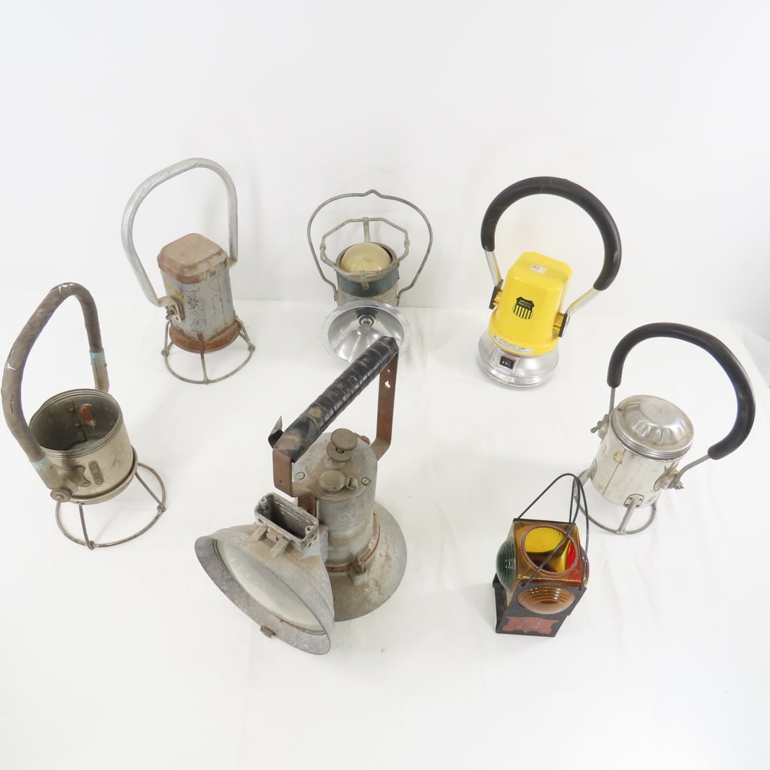 6 Railroad Lantern Style Flashlights & More: Model A Union Carbide Lamp, Justrite, Empire, & Gonger Flashlights. UP Star2007, JA - for parts, RI candle holder. From the estate of the late Dennis Holmes. Please ask questions and read terms & cond