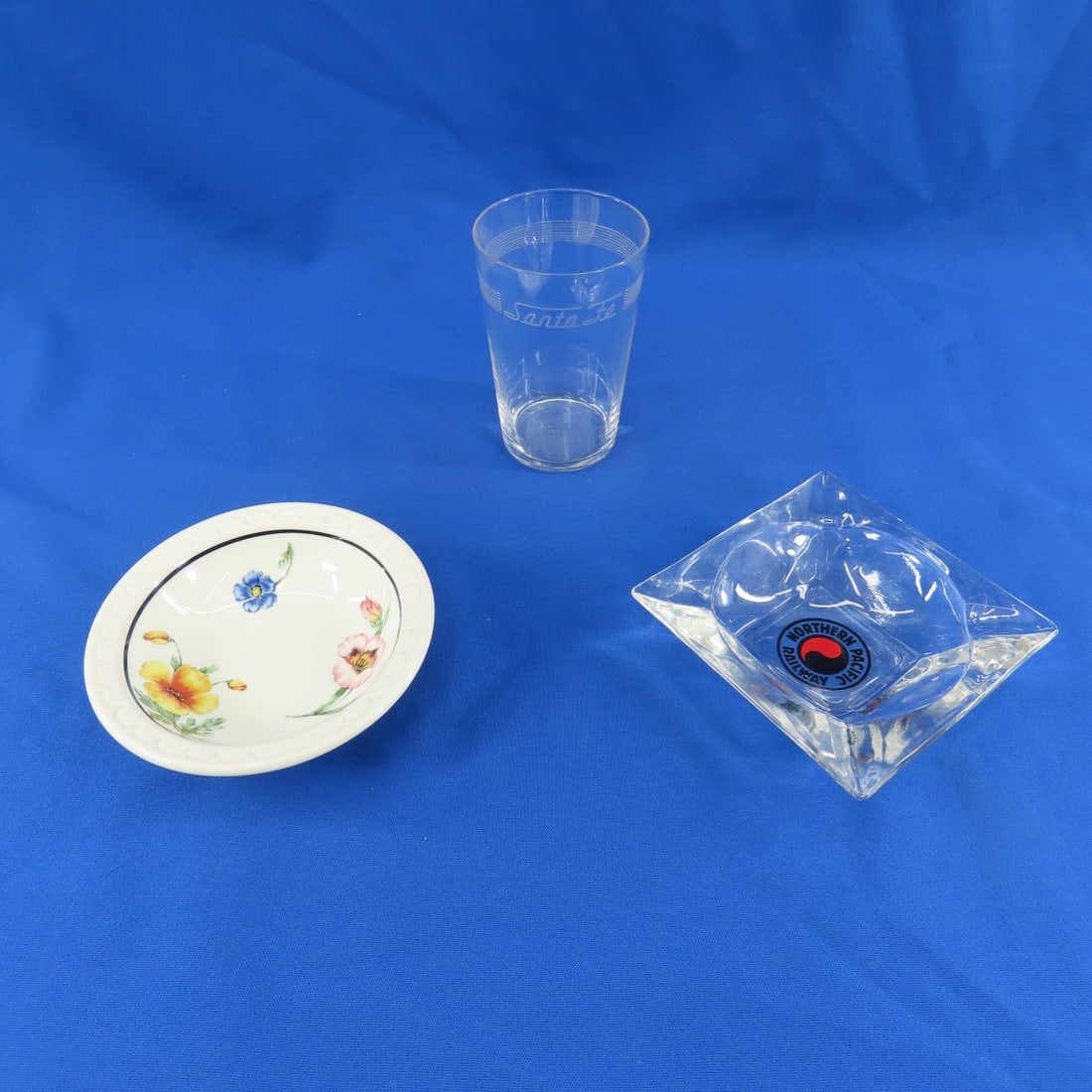 SP Bowl, Santa Fe Glass & NP Ashtray: Southern Pacific Syracuse OP Co 5 1/8" bowl, 8 oz Santa Fe 8 line etched glass 4 1/2" T, NP ashtray. all in very good condition Please ask questions and read terms & conditions before bidding.