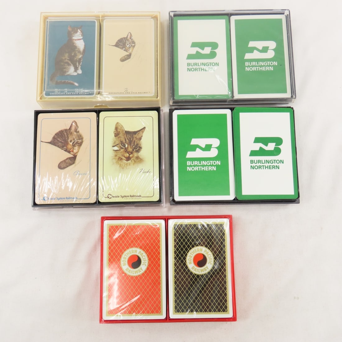 5 Double Packs of Playing cards- NP, BN & Chessie: NP Vista-Dome set- sealed in plastic box with sleeve- like new. Chessie: 1 set- sealed in plastic box with sleeve- like new- except crack in lid and other set decks are sealed in plastic case- like ne