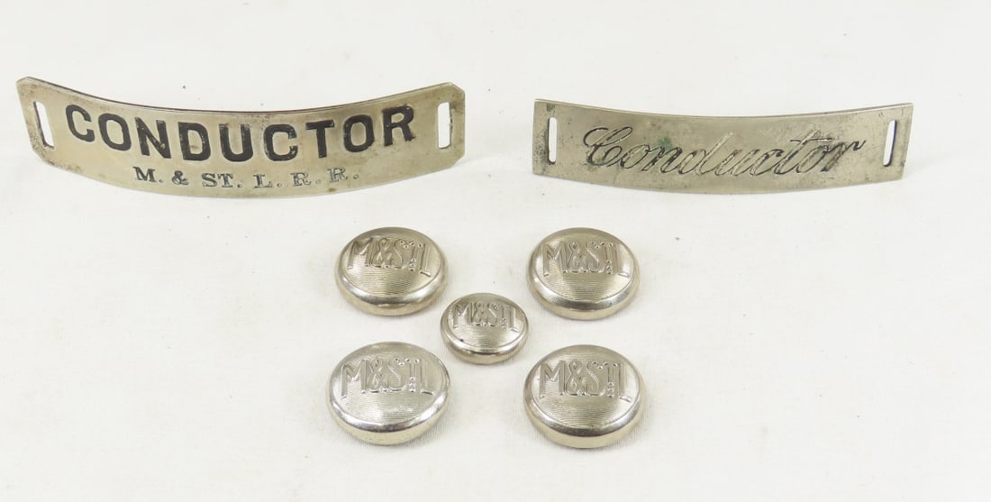 M&STLRR Conductor Badges & Button covers: 1 badge with "Conductor M&STLRR", and other with "Conductor" has pin soldered to back, 4 large & 1 small button cover with M&STL. From the Collection of Don L. Hofsomer. Please ask questions and read 