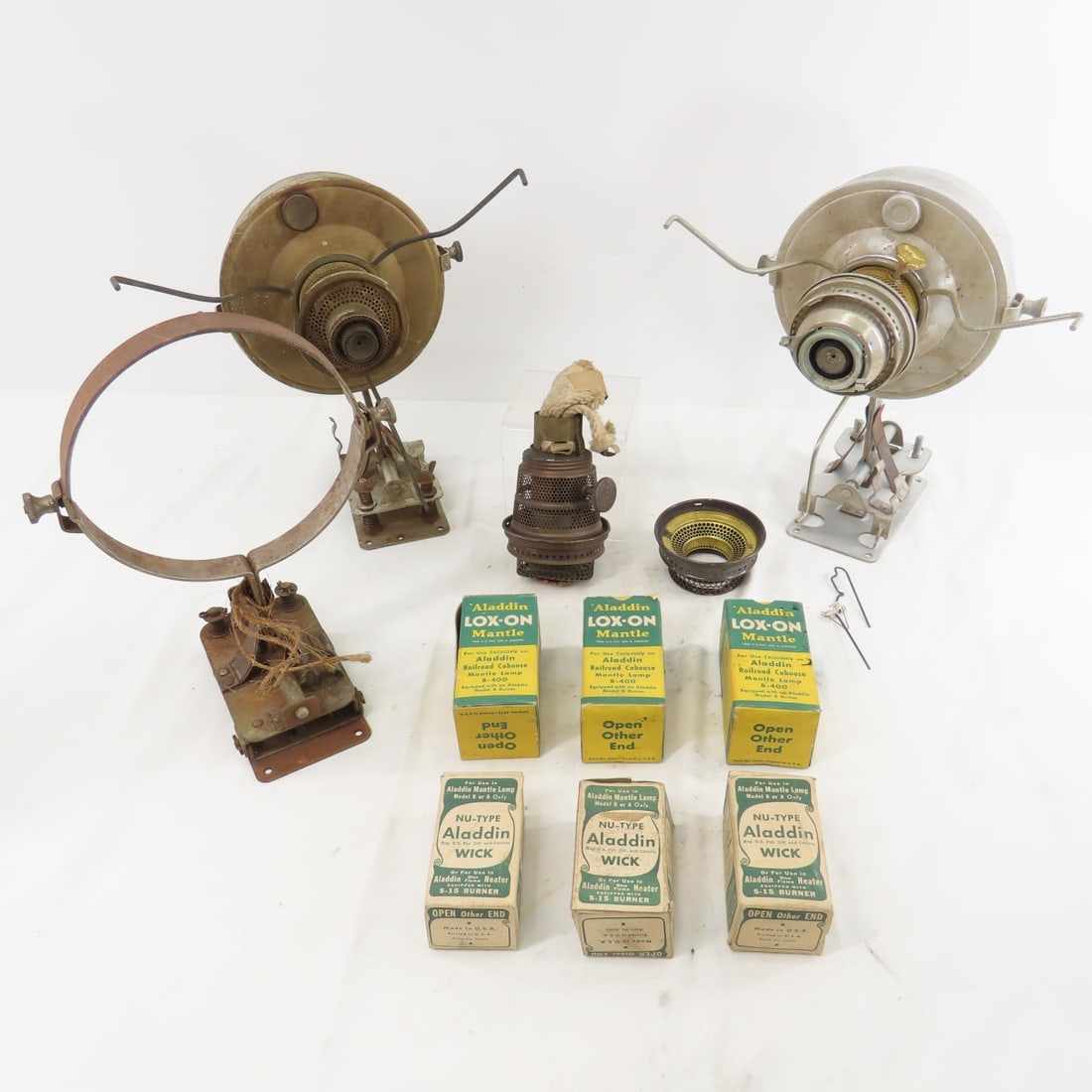 2 Caboose Lamp Brackets & Founts, Mantles & Wicks: 3 boxes of Mantles and 3 Boxes of Wicks Please ask questions and read terms & conditions before bidding.