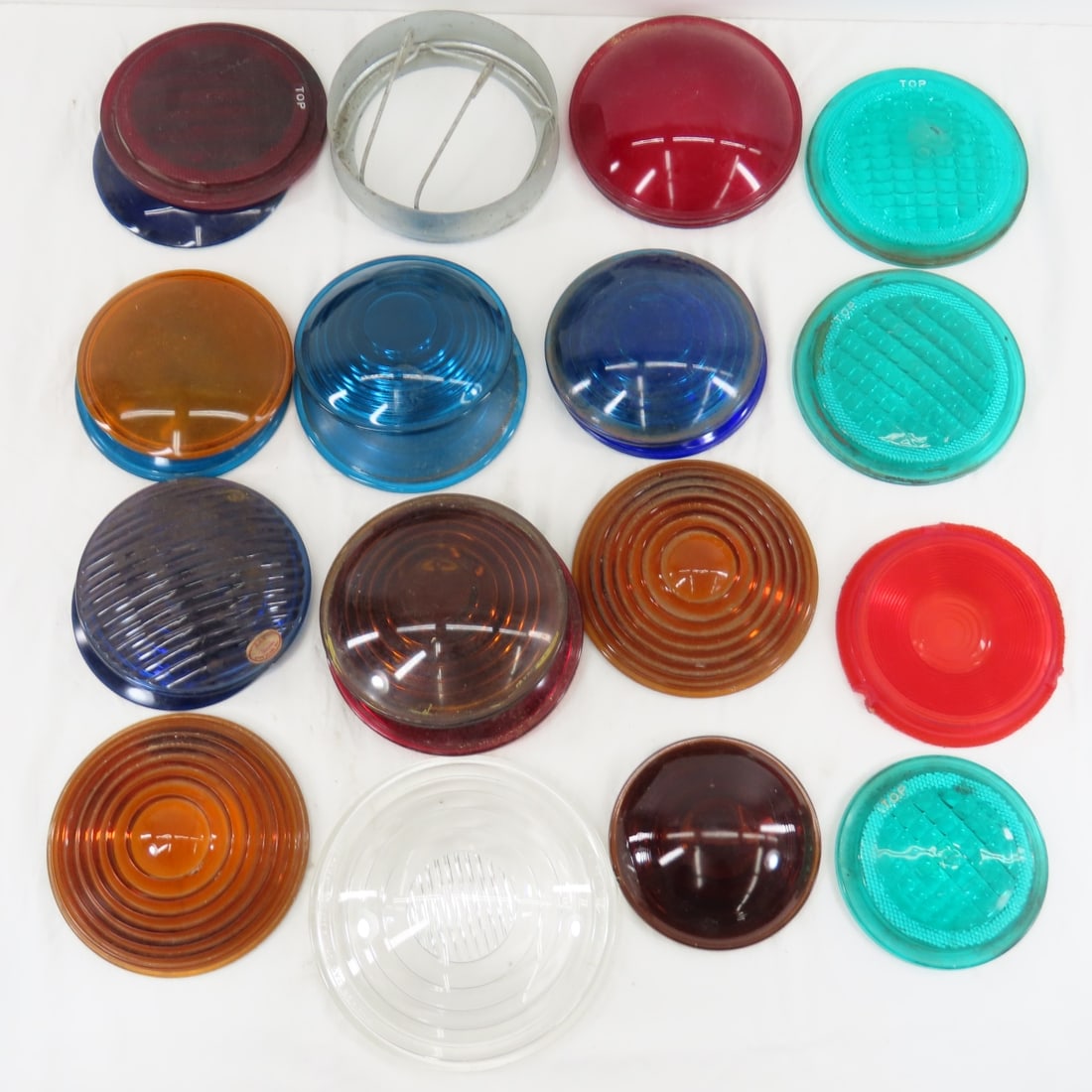 Assorted Color Glass Lamp Lenses: most are glass, a few plastic, a few frames. From the estate of the late Dennis Holmes. Please ask questions and read terms & conditions before bidding.