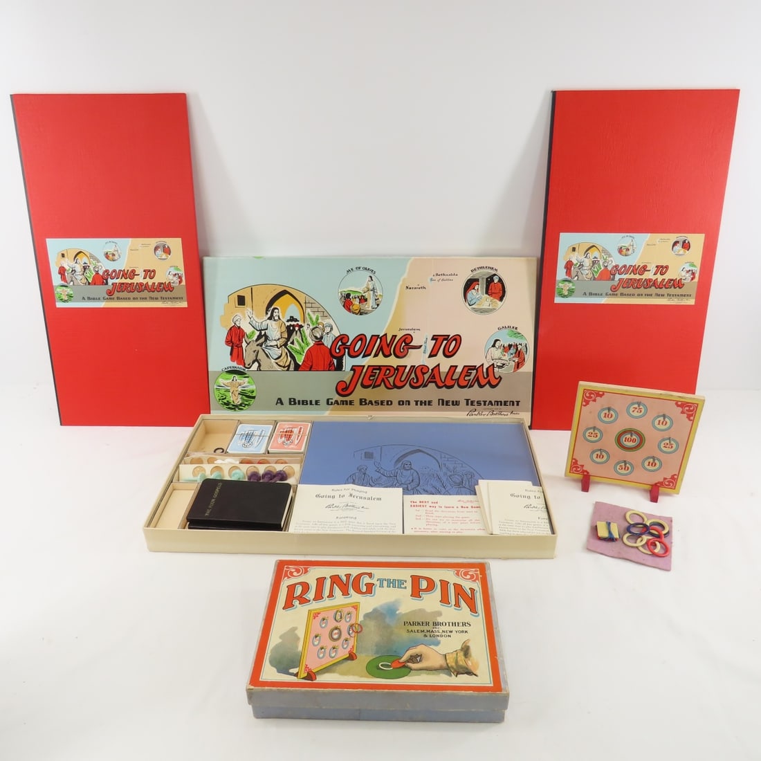 Vintage Going to Jerusalem & Ring the Pin Games: Vintage Going to Jerusalem & Ring the Pin Games -1955 Going to Jerusalem: 2 boards, 12 figures, cards, 3 sets of rules, 1 colored ring, 2 books, all in original box (minor edge damage) Ring the Pin in