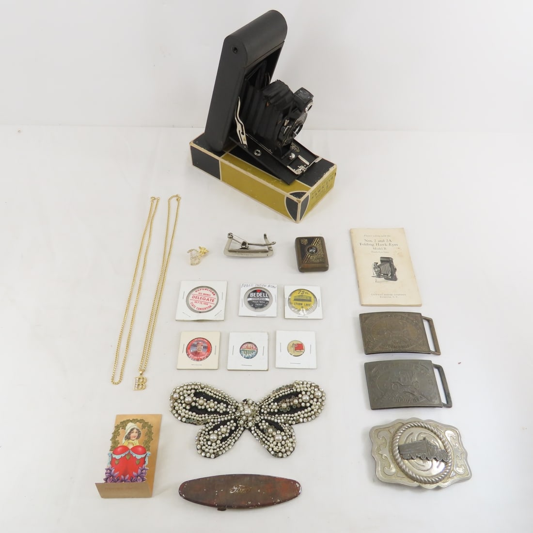 Belt buckles, pins, camera, jewelry & more: Belt buckles, pins, camera, jewelry & more - Please ask questions and read terms & conditions before bidding.