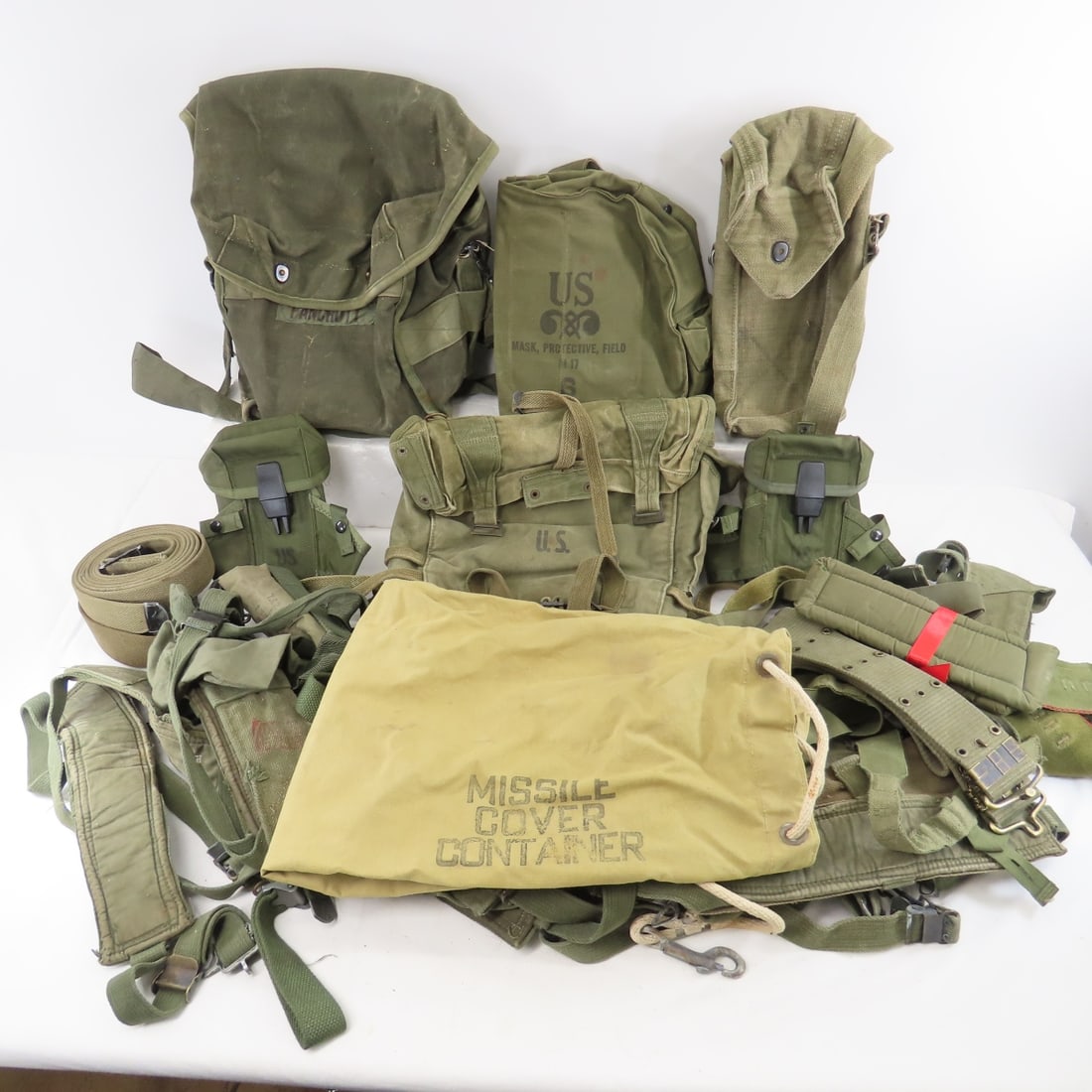 Bin full of mixed Military canvas, ammo pouches: Bin full of mixed Military canvas, ammo pouches-belts, bags, straps & more Please ask questions and read terms & conditions before bidding.