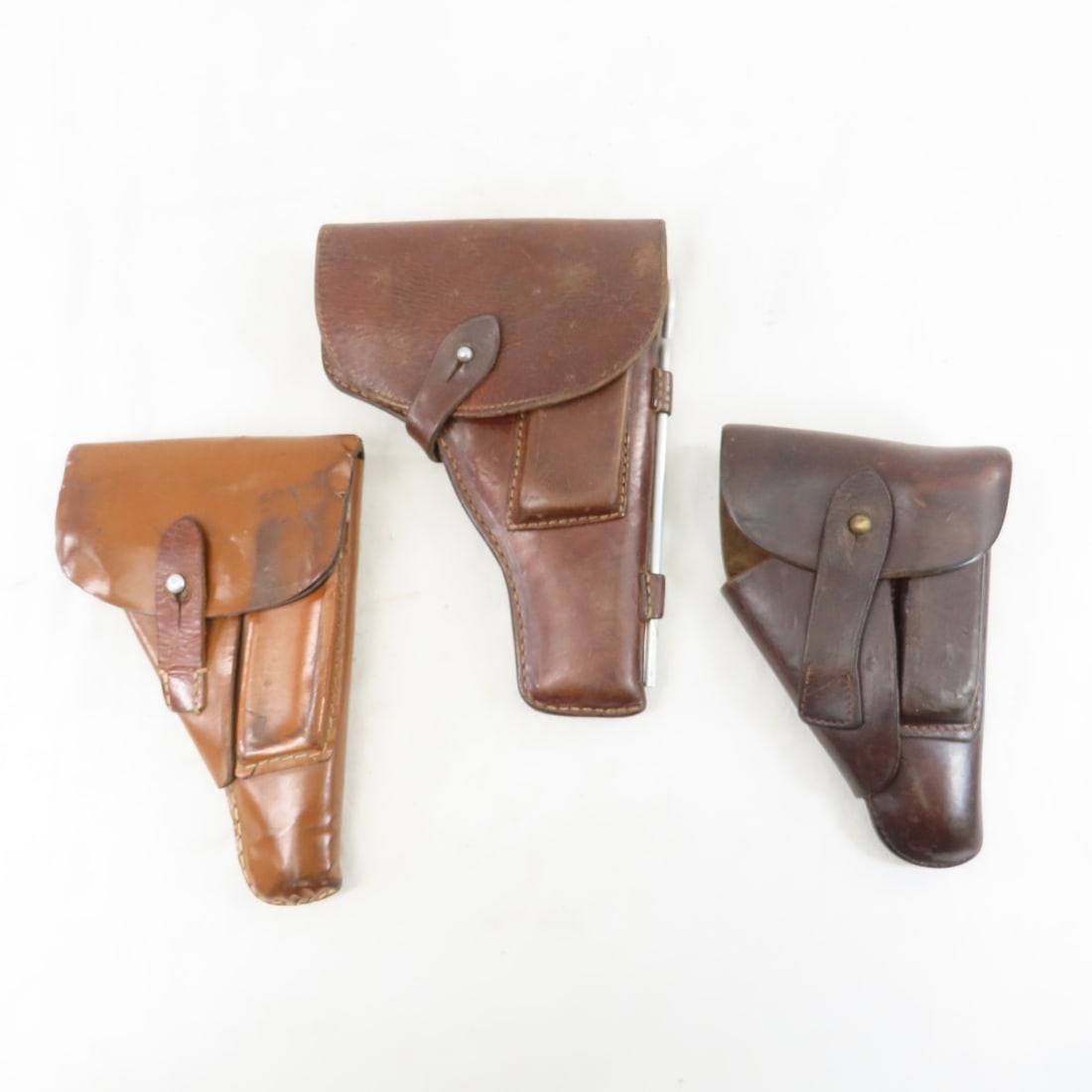 3 Vintage Unmarked Leather Pistol Holsters: 3 Vintage Unmarked Leather Pistol Holsters- Please ask questions and read terms & conditions before bidding.