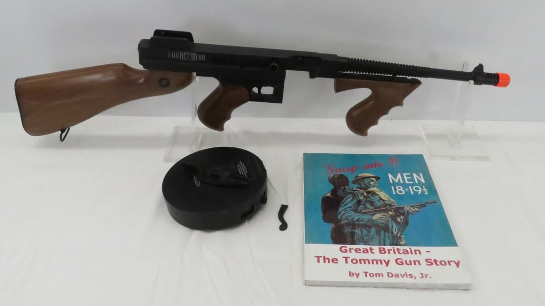 Thompson Electric Powered Soft Air Submachine Gun: Thompson Electric Powered Soft Air Submachine Gun - .6mm, U.S. Model 1928, Hopper, Parts Broken, Untested + Tommy Gun Story Book Please read terms & conditions and ask questions before bidding.