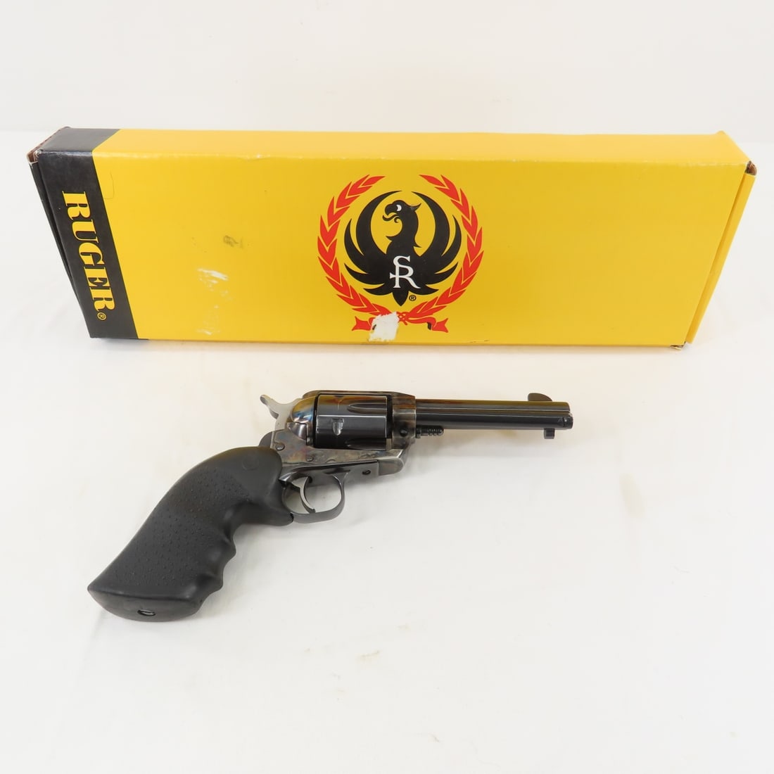 Ruger Vaquero .45 Cal Revolver with Box: Ruger Vaquero .45 Cal Revolver with Box - 4 5/8" barrel, 6 shot, rubber grips, serial # 55-89396. Manufactured 1993-2005. Overall very good condition. FFL transfer required, please know local laws bef