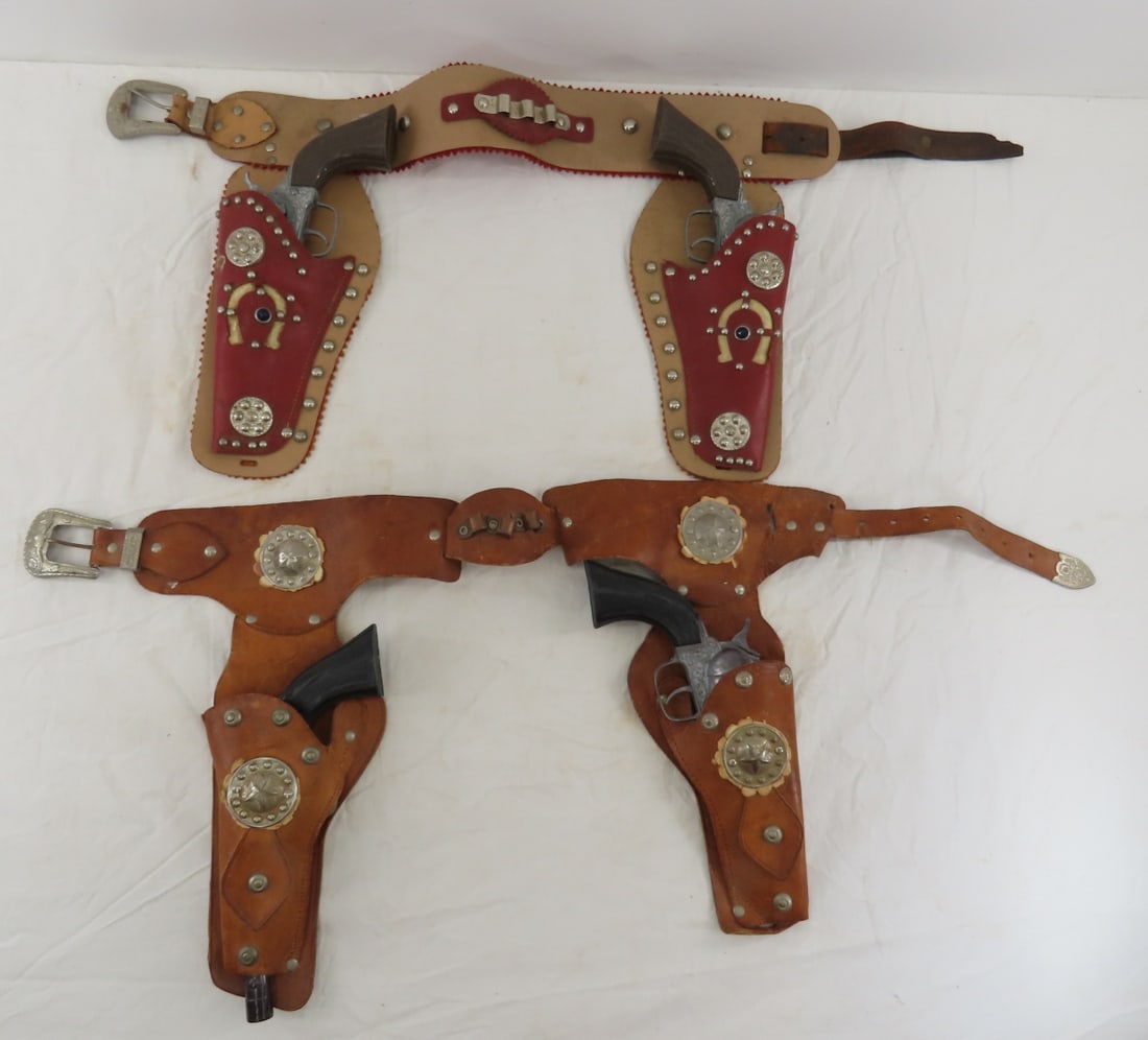 4 Vintage Pony Boy Cap Guns with Holster Belts: 4 Vintage Pony Boy Cap Guns with Holster Belts - all 4 work- 1 has loose chamber door, 1 pair brown grips, other are black, 2 leather holsters and belts Please ask questions and read terms & condition