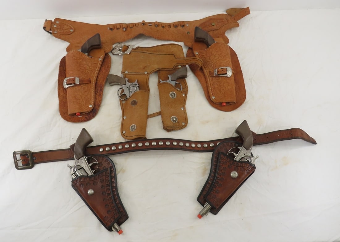 6 Spanish Gonher Cap Guns in Holster Belts: 6 Spanish Gonher Cap Guns in Holster Belts - all work, 1 belt has 1 toy bullet Please ask questions and read terms & conditions before bidding.
