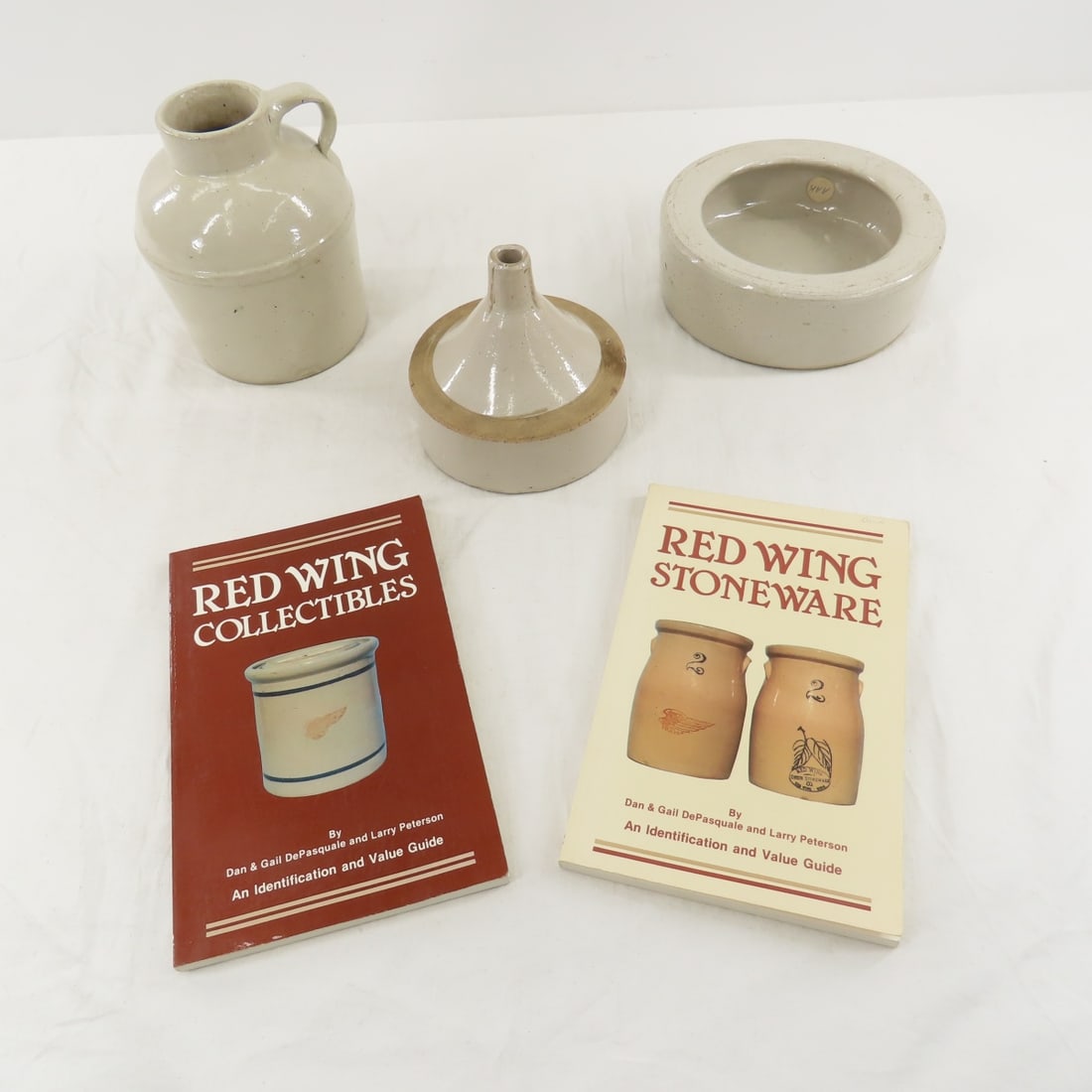 "RWSW" Wide Mouth Jug, Funnel, Dish & Books: "RWSW" Wide Mouth Jug, Funnel, Dish & Books - 1 qt. jug is bottom marked RWSW, 5" funnel and 6.5" dish are unmarked. Red Wing Stoneware & Red Wing Collectibles -autographed Please read terms & conditi