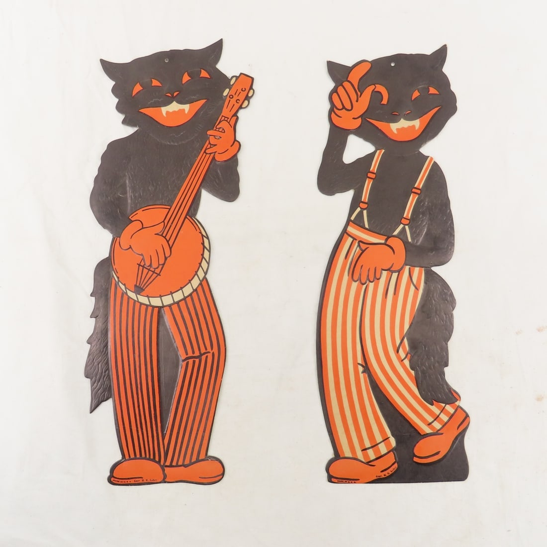 2 Vintage M.E. Luhrs Halloween Cat Decorations: 2 Vintage M.E. Luhrs Halloween Cat Decorations - 17x6" embossed cardboard in excellent condition Please read terms & conditions and ask questions before bidding.