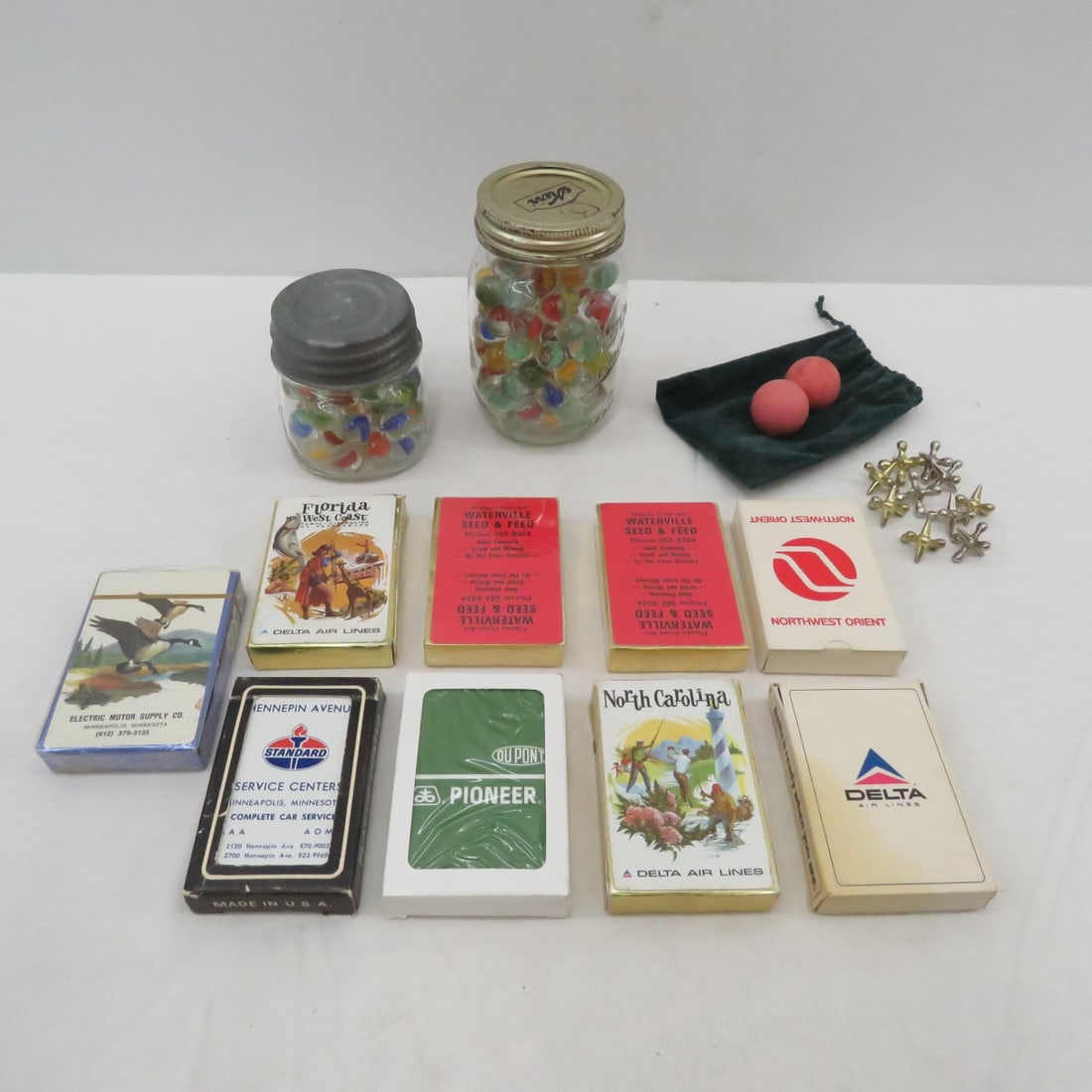 Marbles, Playing Cards & Jacks: Marbles, Playing Cards & Jacks - 2 Jars of Marbles, 8 Packs of Vintage Advertising Playing Cards Including Delta, Standard, NW Orient, only One Sealed, Jacks & Balls Set Please read terms & conditions